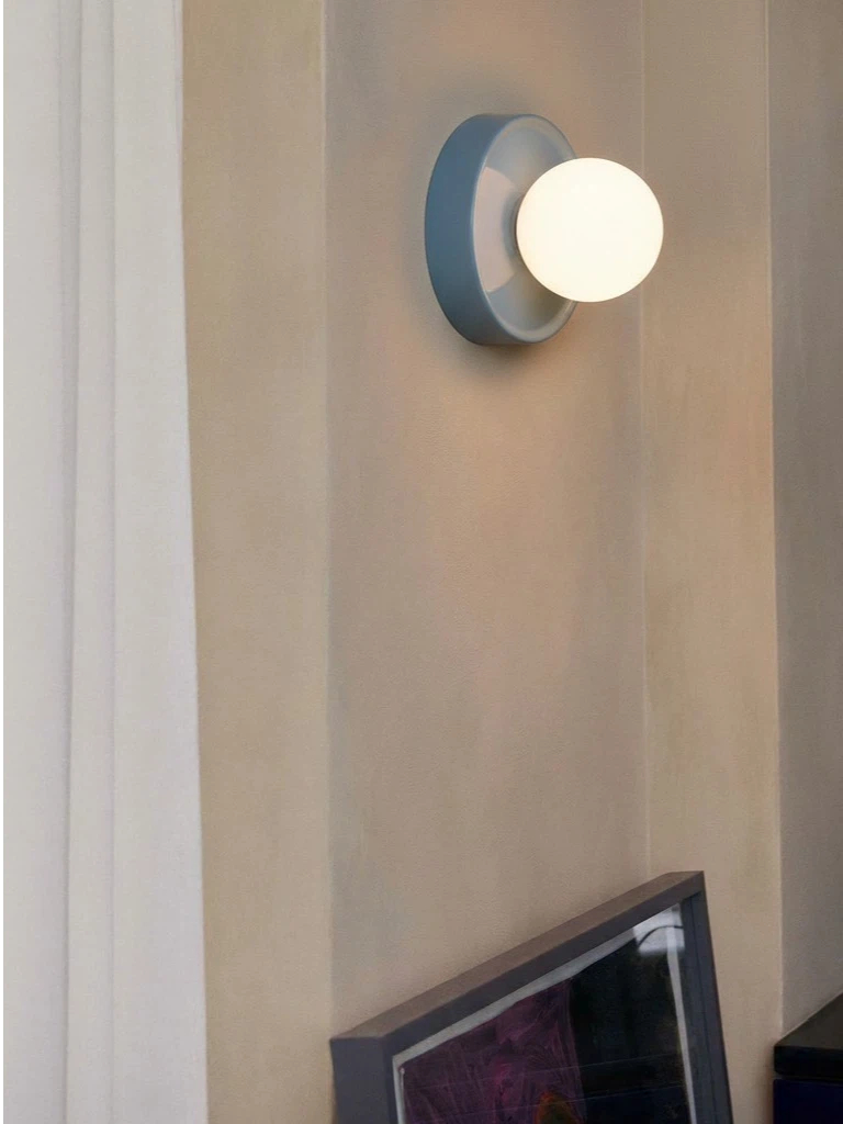 Customer photo of blue round glass wall lamp on wall