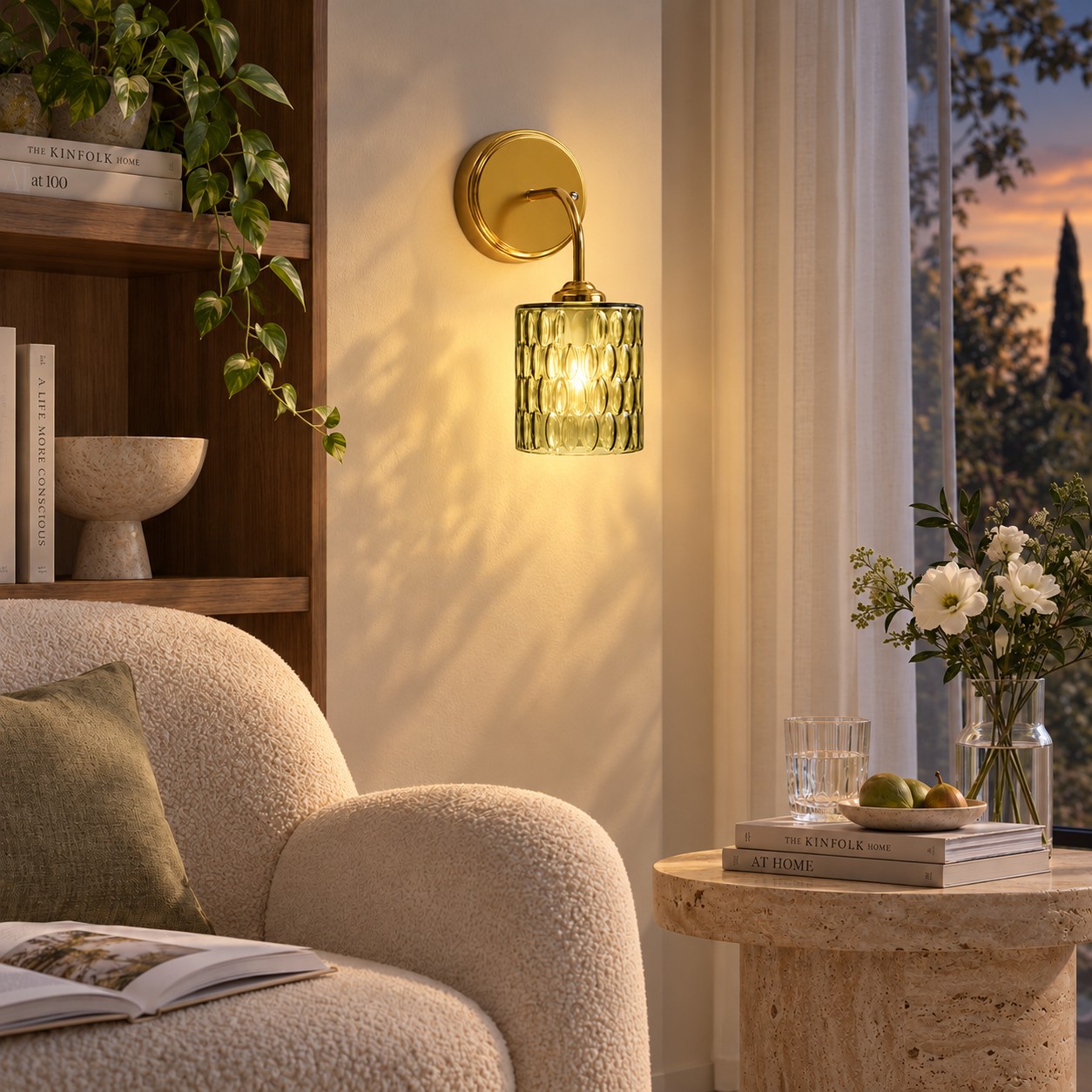Green hammered-glass sconce by a chair, lights on